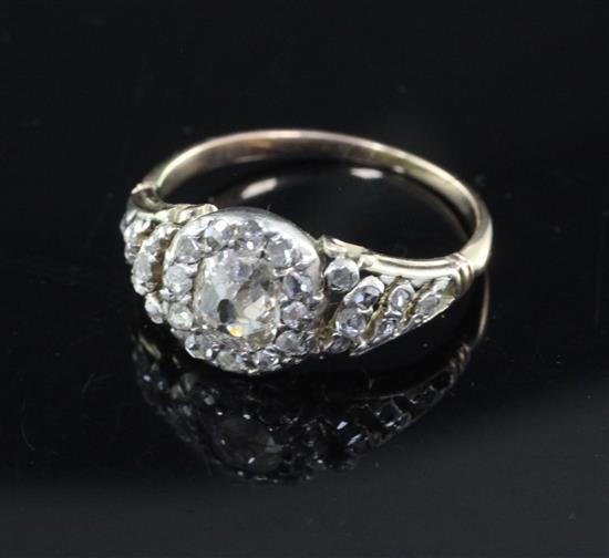 A Georgian gold, silver and diamond set cluster ring, size M/N.